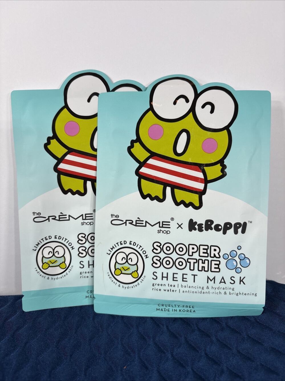 The creme shop x Keroppi sheet mask Scooper Soothe Green Tea Hydrating Masks